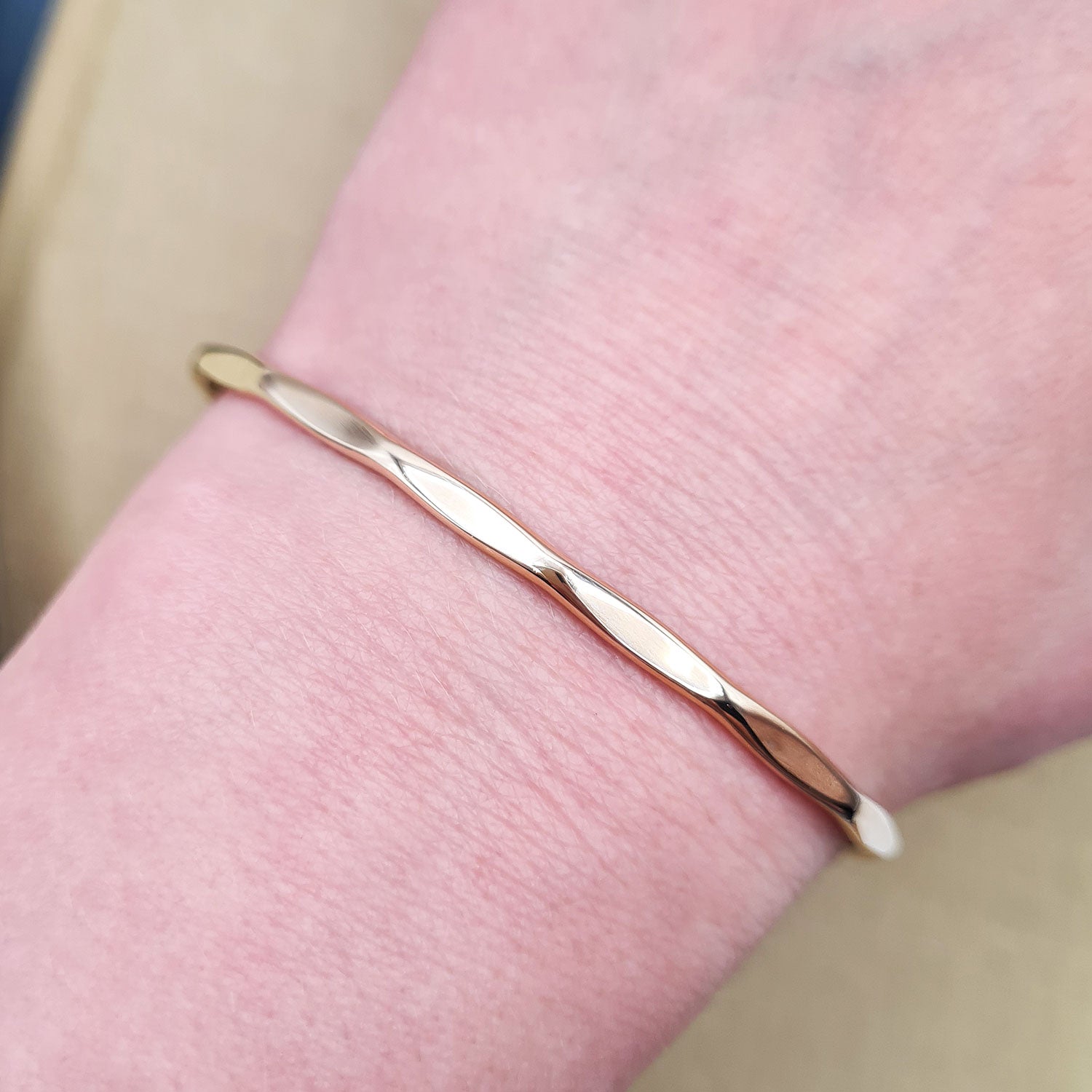 women wearing our gold toque bangle