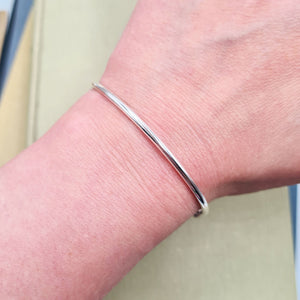 woman wearing our silver torque bangle