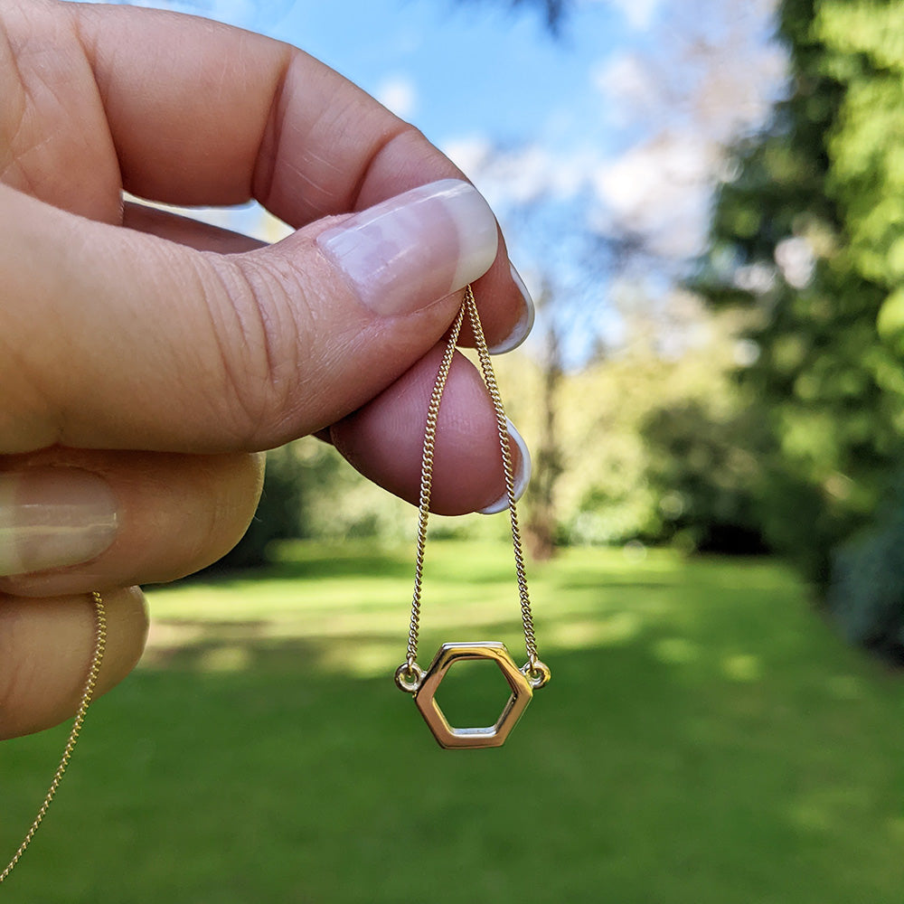 hexagon necklace in hand