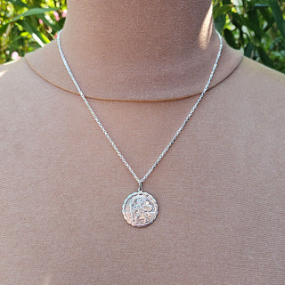 St Christopher necklace being worn