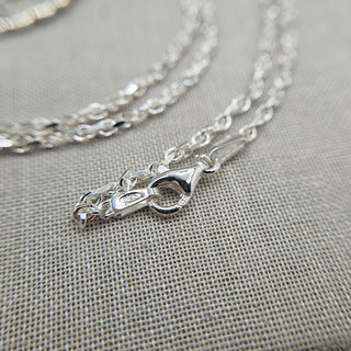 close up of silver belcher chain