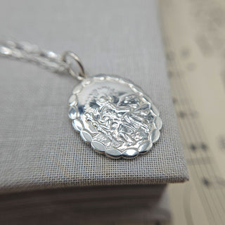 scalloped st christopher medal in sterling silver