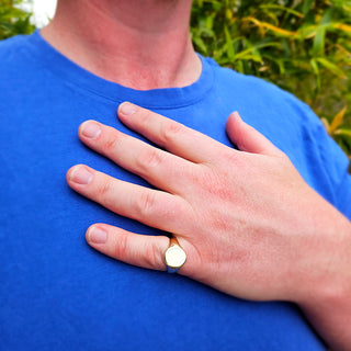 photo of man wearing yellow gold signet