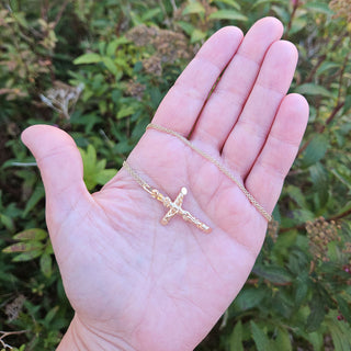 crucifix in hand for scale