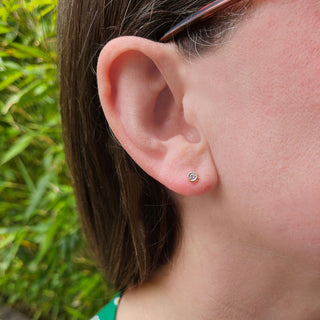 tiny topaz earrings in gold