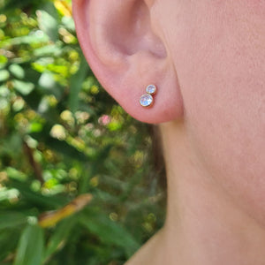 double cz stud earrings mnodelled in woman's ear