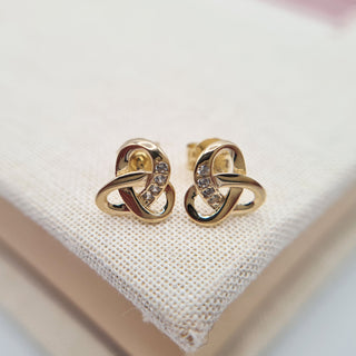 small knot studs in yellow gold