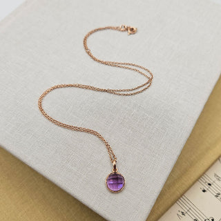 amethyst pendant on rose gold chain
