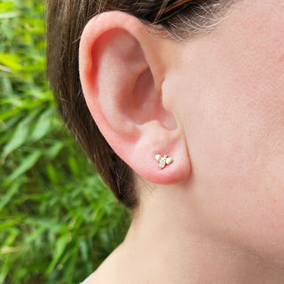 bee earrings in ear