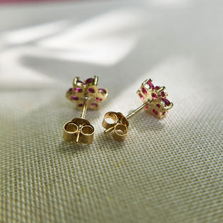 gold and ruby women's stud earrings