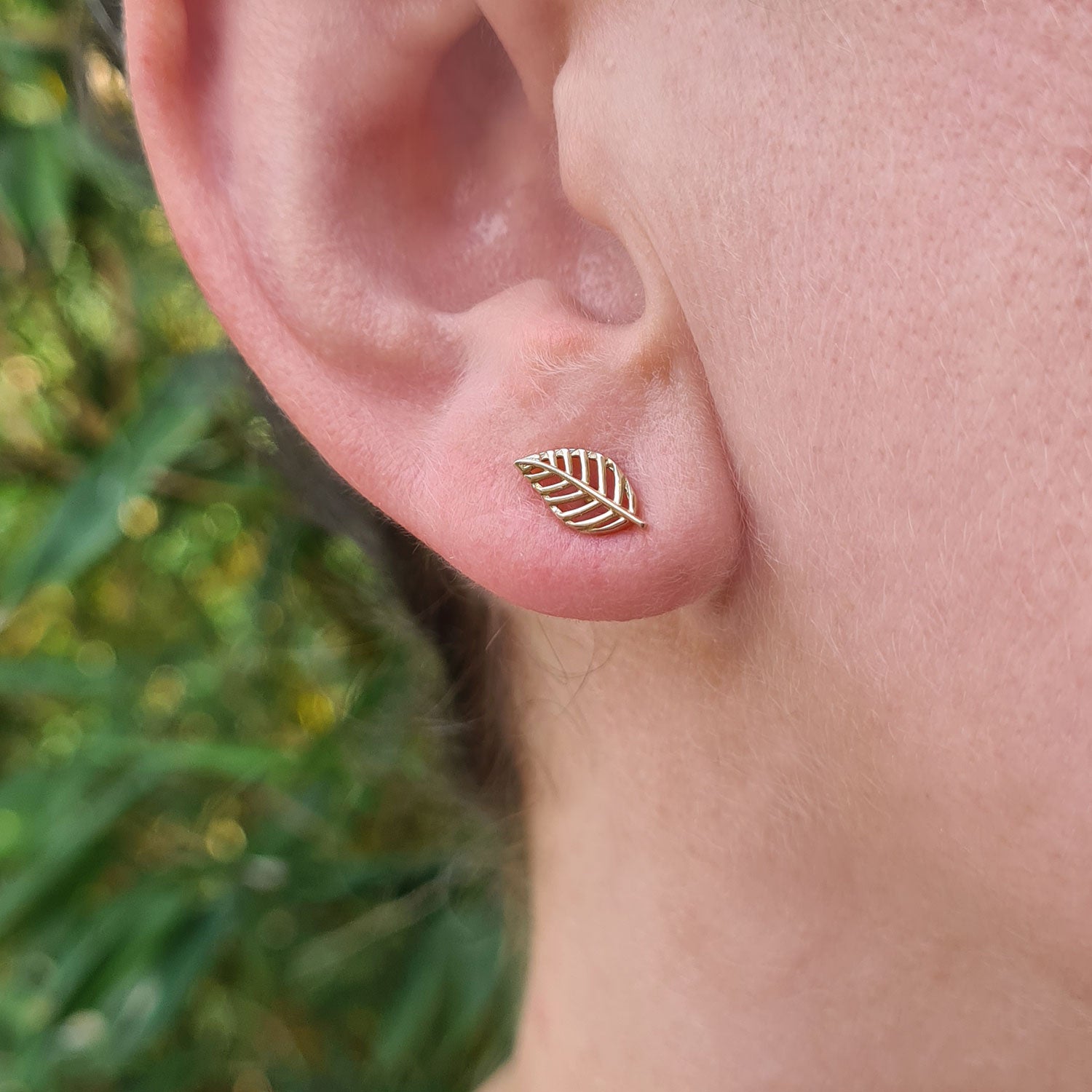 solid gold leaf shaped stud earrings