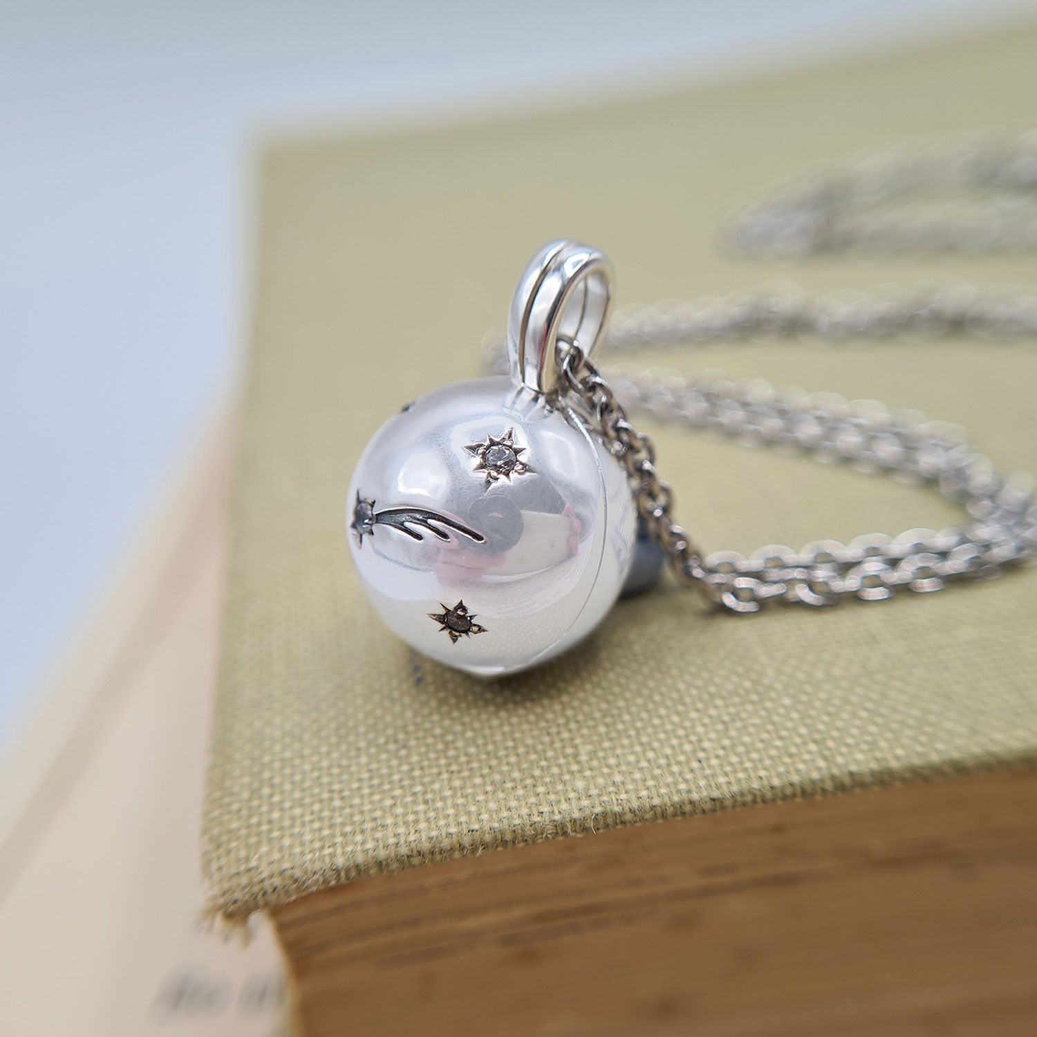 ball locket with shooting star design
