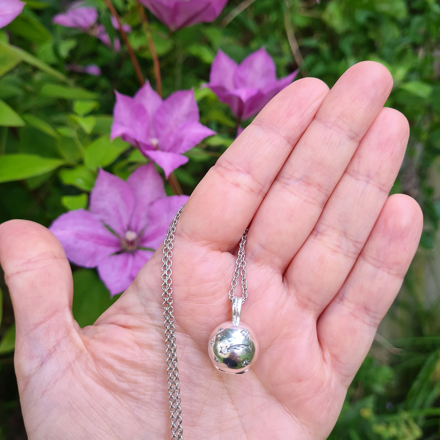 Silver ball shop locket pendant