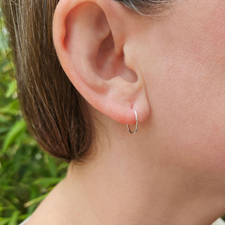 small silver sleeper hoops in ear