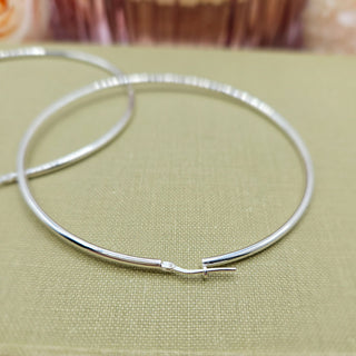 close up of lever fitting on giant hoop earrings