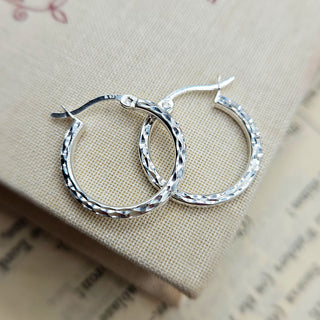 small hammered hoop earrings in silver