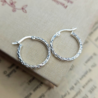 sterling silver hoop earrings with a hammered finish