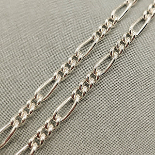 close up of 5mm wide figaro chain in sterling silver