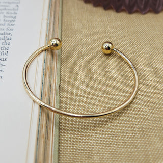 ladies solid gold torque bangle