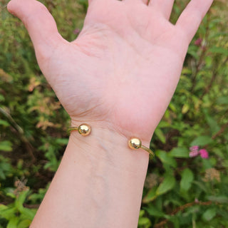 gold bangle on ladies wrist