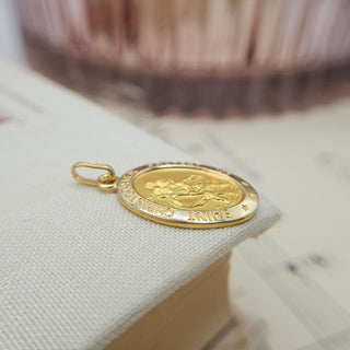 side profile of gold oval st christopher medal
