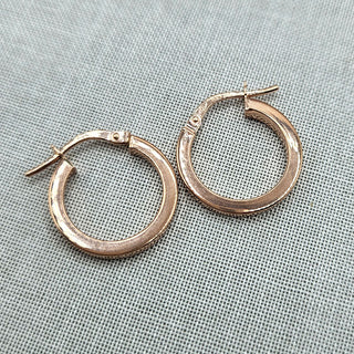 close up of small 9ct rose gold hoops