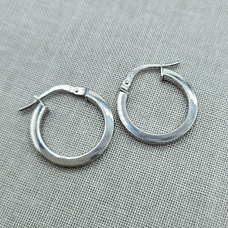 close up of small 9ct yellow gold hoops