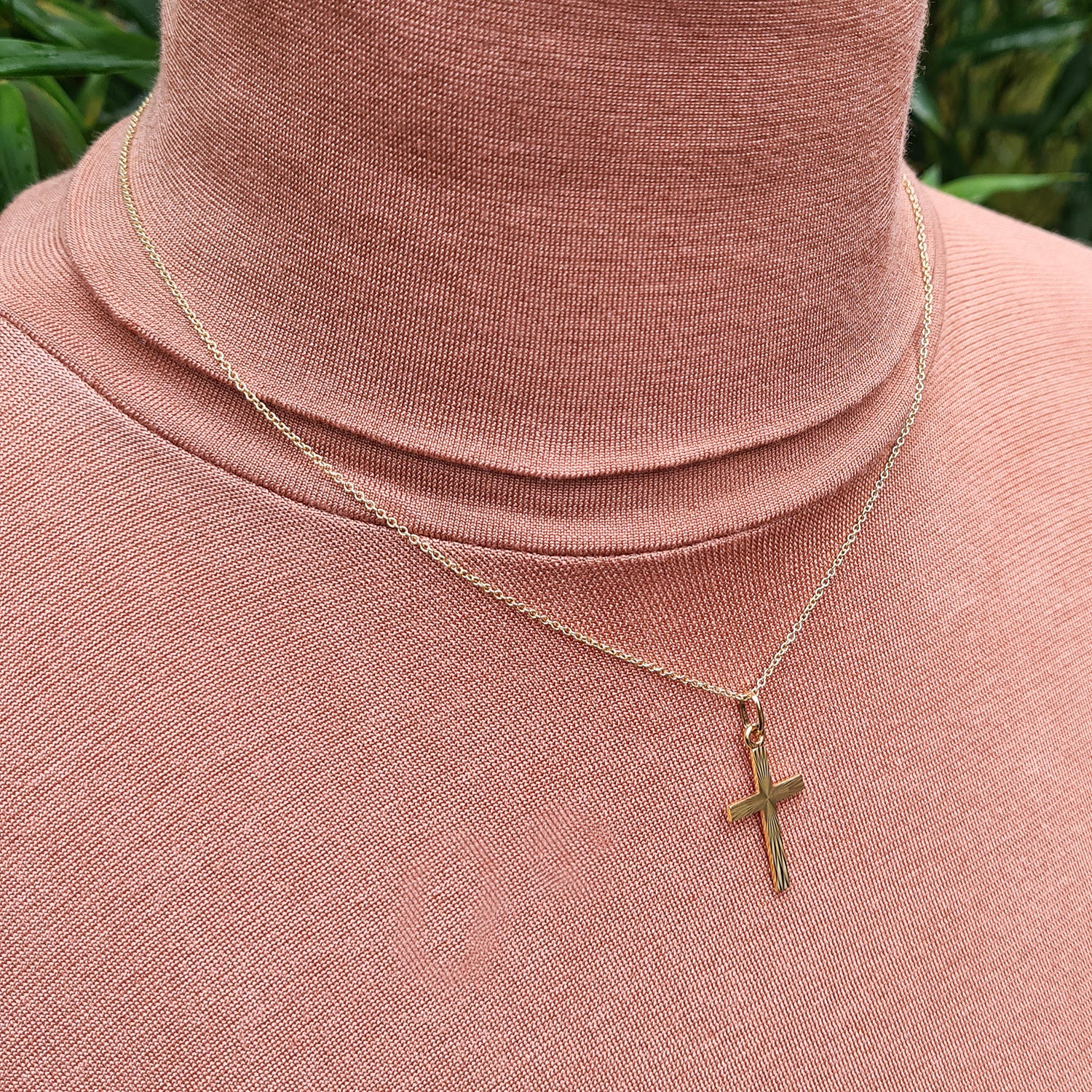 another view of gold cross necklace