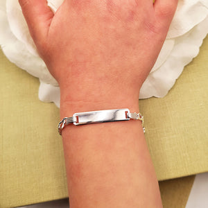silver bracelet on child's wrist