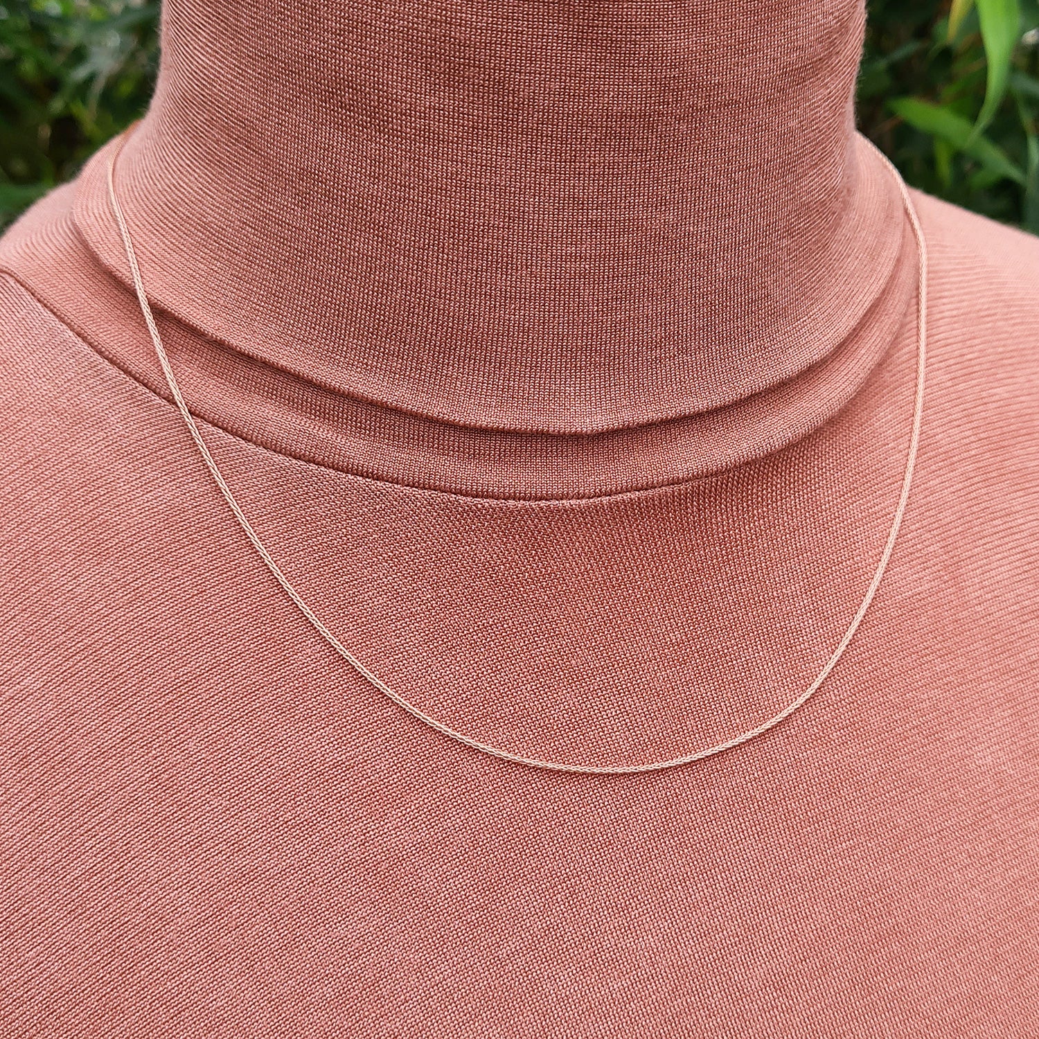 rose gold chain on neck