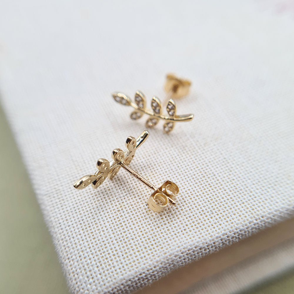 butterfly fitting on women's gold earrings