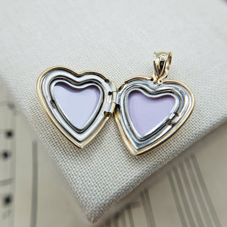 space in side gold locket for 2 photos
