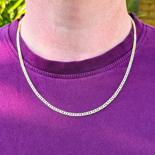 yellow gold anchor chain on men's neck