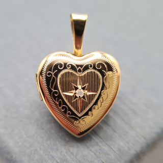 tiny yellow gold locket with diamond