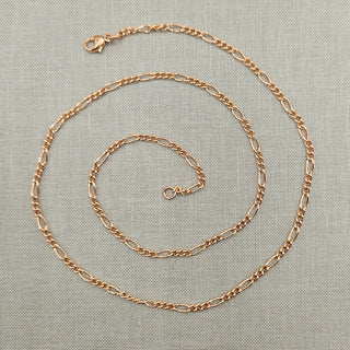 solid rose gold necklace with figaro links and a lobster clasp