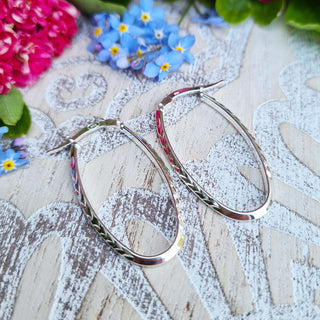 sterling silver patterned oval hoop earrings