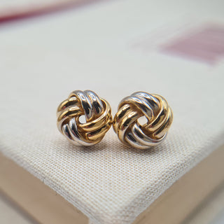 close up and yellow and white knot earrings