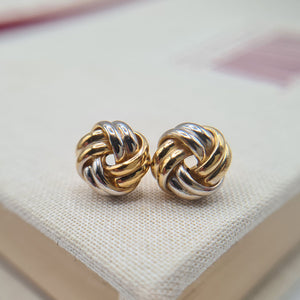 close up and yellow and white knot earrings