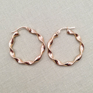 women's real gold hoop earrings with a twisted design