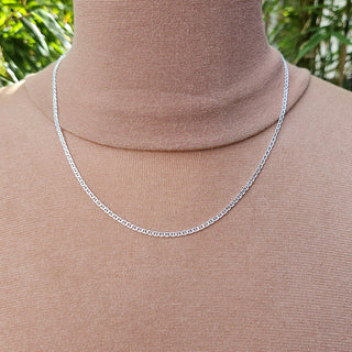 dainty silver anchor chain on neck