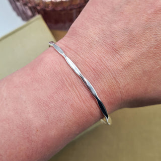 ladies slim silver bangle on wrist