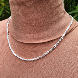 another view of silver byzantine chain on neck