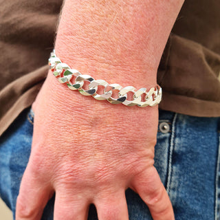 heavy curb bracelet on man's wrist