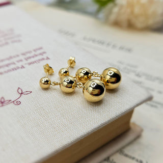 graduated ball dangle earrings