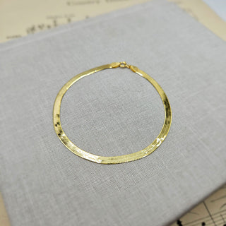 another view of ladies flat snake bracelet in 9K gold