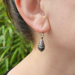 bali style earrings in ladies ear