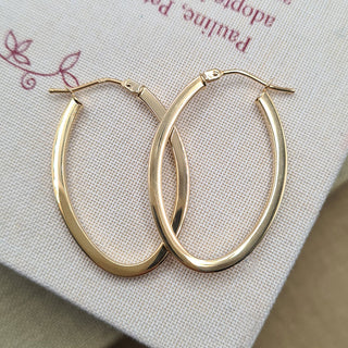 women's yellow gold oval  hoop earrings