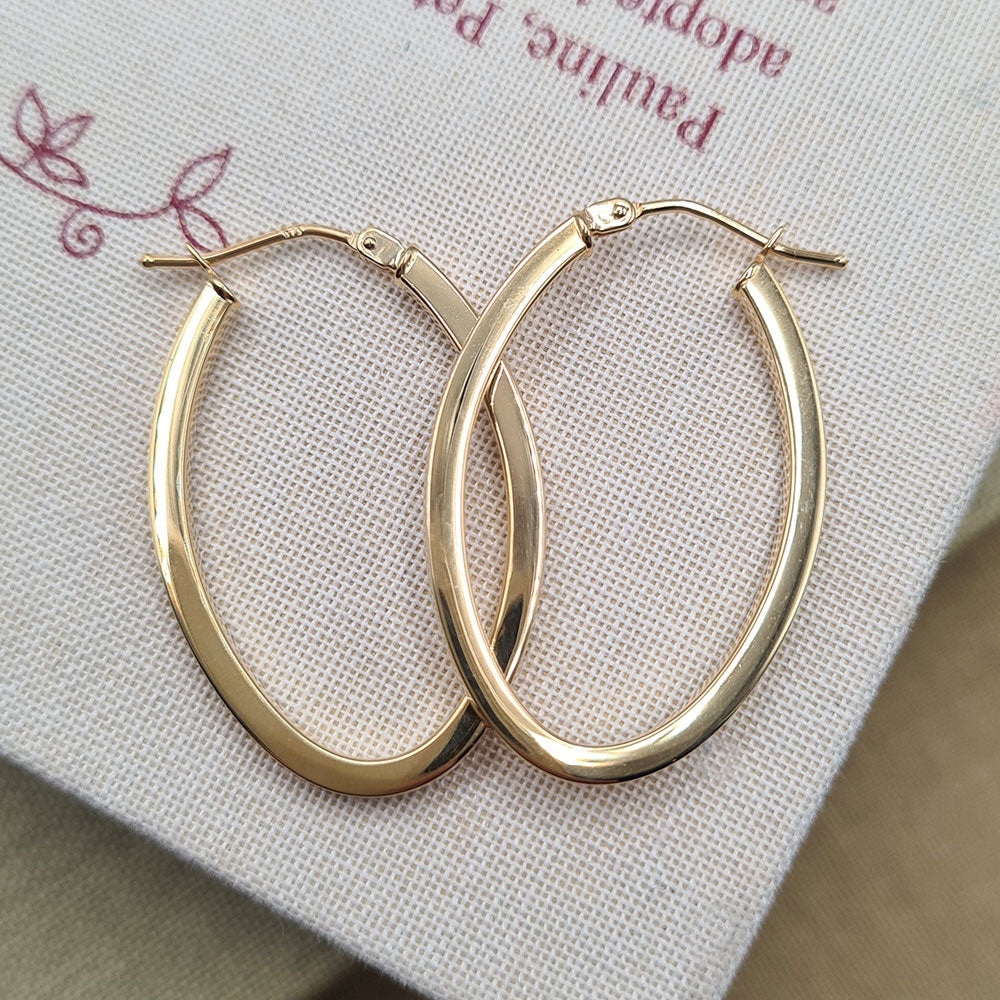 women's yellow gold oval  hoop earrings