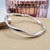 women's twisted hinge bangle in sterling silver
