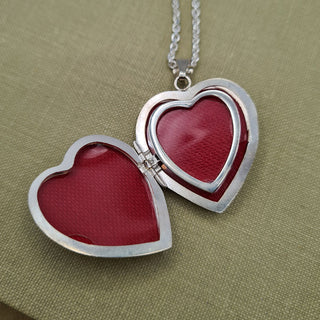 inside of silver heart locket and room for 4 photos